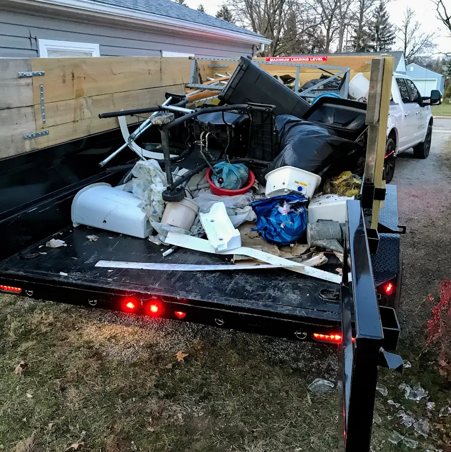Roll-off dumpster delivered to a residential driveway in Bedford